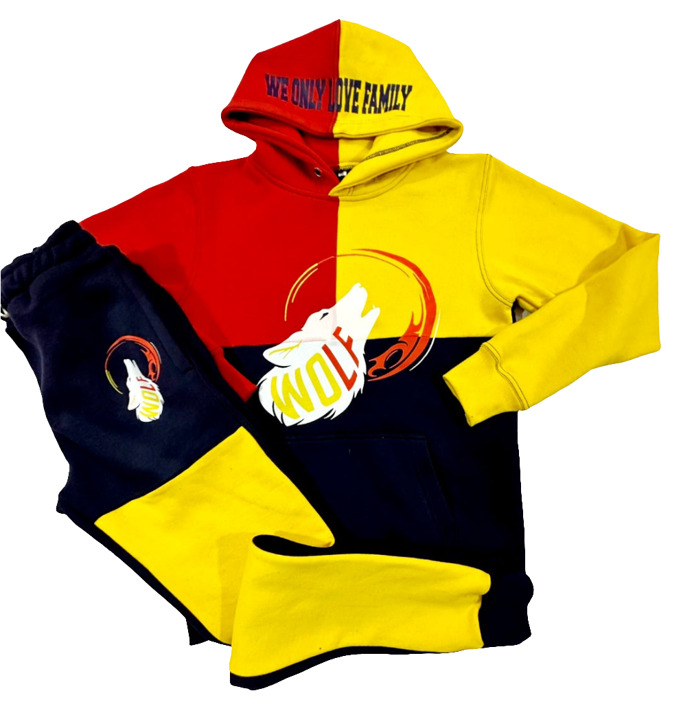A color block hooded sweatsuit with red, yellow, and black color-blocking. Features the 'WOLF' logo design in red, white, and yellow on the hoodie and 'WOLF' spelled out vertically on the left leg of the matching sweatpants.