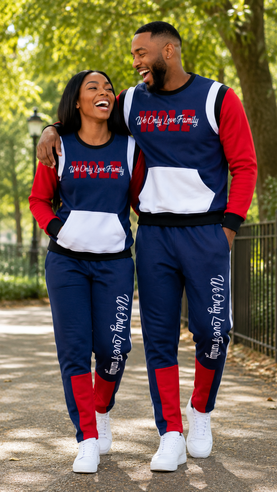 Couple modeling matching WOLF Two-Tone Family Signature sweatshirt and jogger sets outdoor.