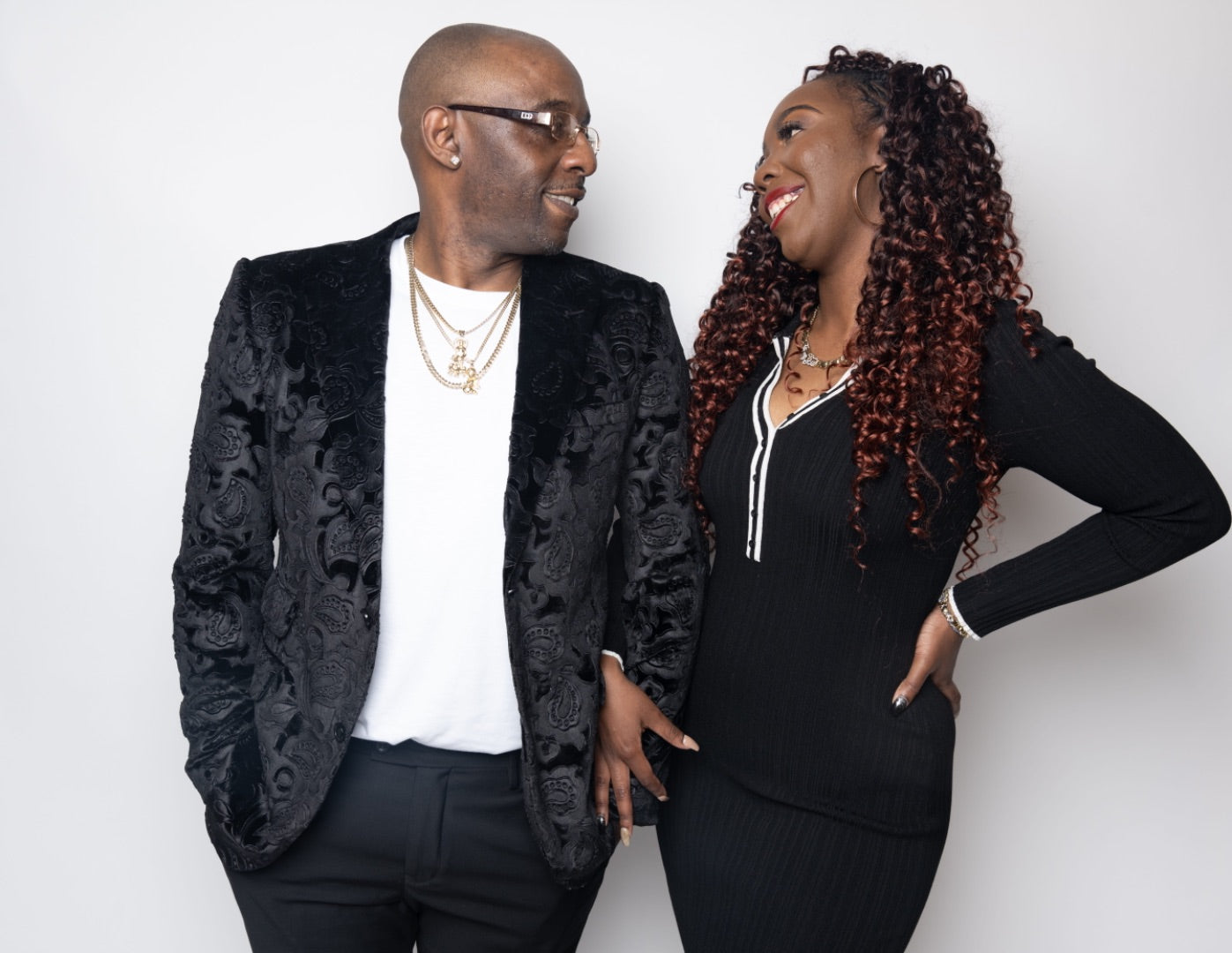 George and Essence Myrick, founders of Royal Reigns Design, standing together.